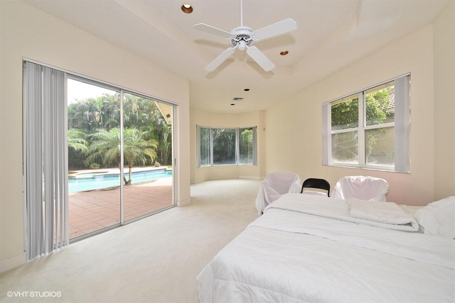 3912 Northwest 52nd Street Boca Raton, FL 33496 - Photo 13 of 17 09_3912NW52ndSt_14_MasterBedroom_LowRes