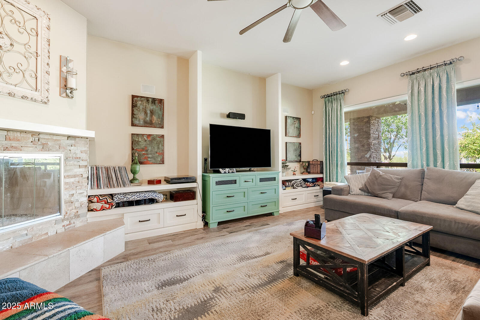 8705 South 24th Place Phoenix, AZ 85042 - Photo 12 of 43 a living room with furniture and a flat screen tv