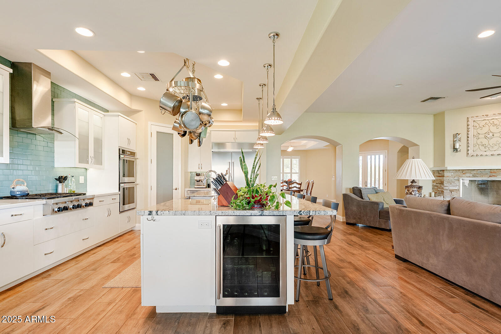 8705 South 24th Place Phoenix, AZ 85042 - Photo 18 of 43 a living room with fireplace furniture and a wooden floor