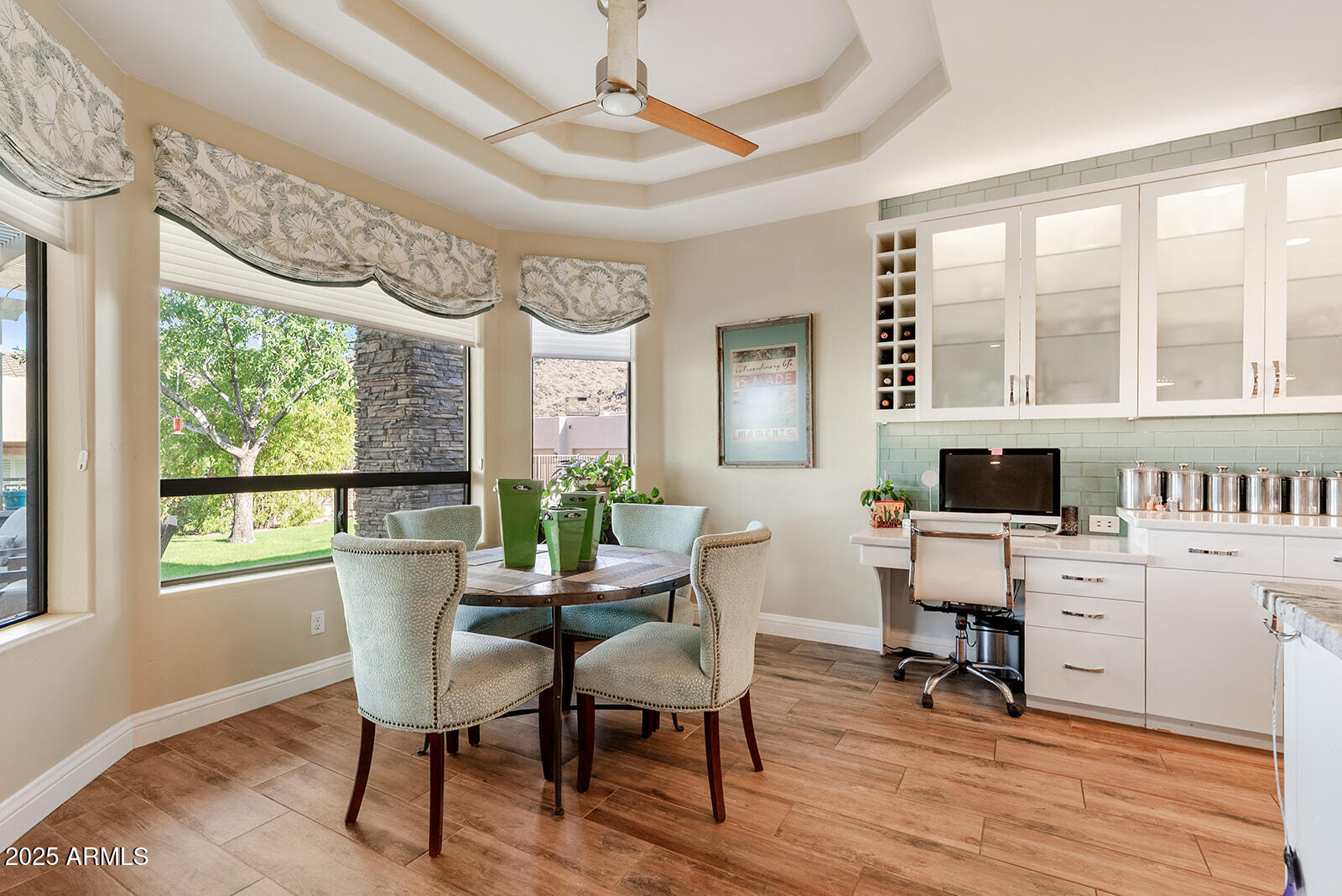 8705 South 24th Place Phoenix, AZ 85042 - Photo 19 of 43 a view of a dining room with furniture window and wooden floor
