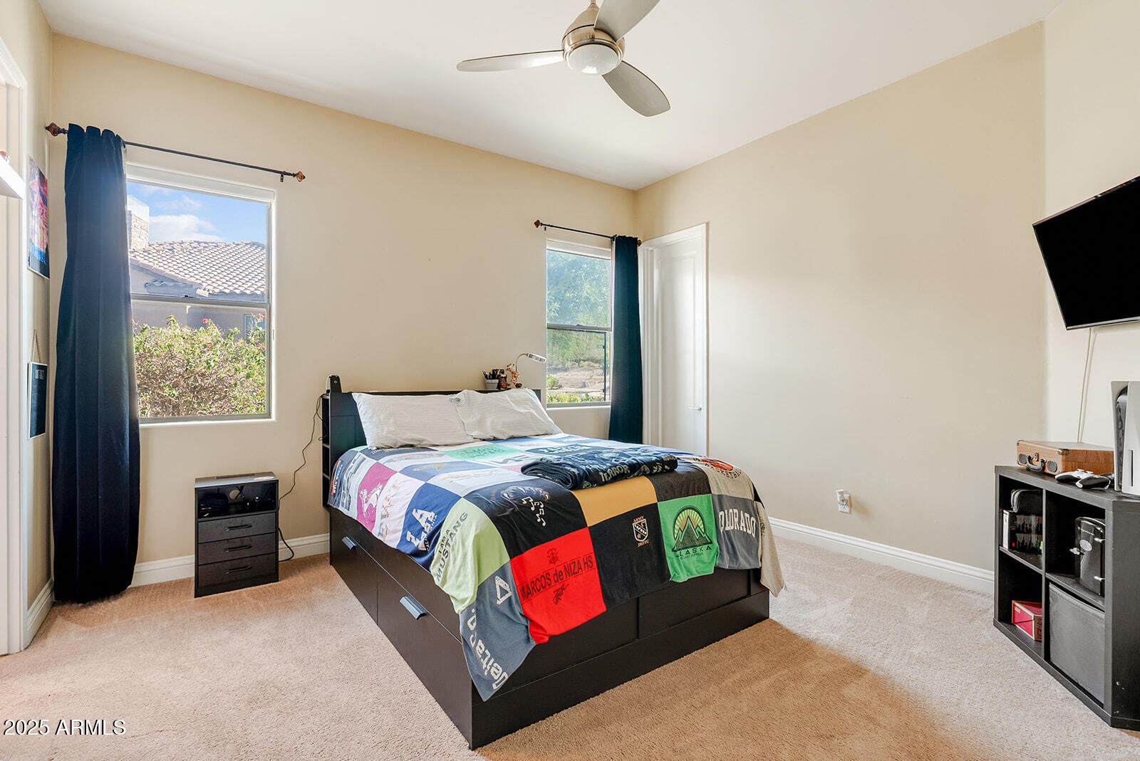 8705 South 24th Place Phoenix, AZ 85042 - Photo 22 of 43 a bedroom with a bed and a television