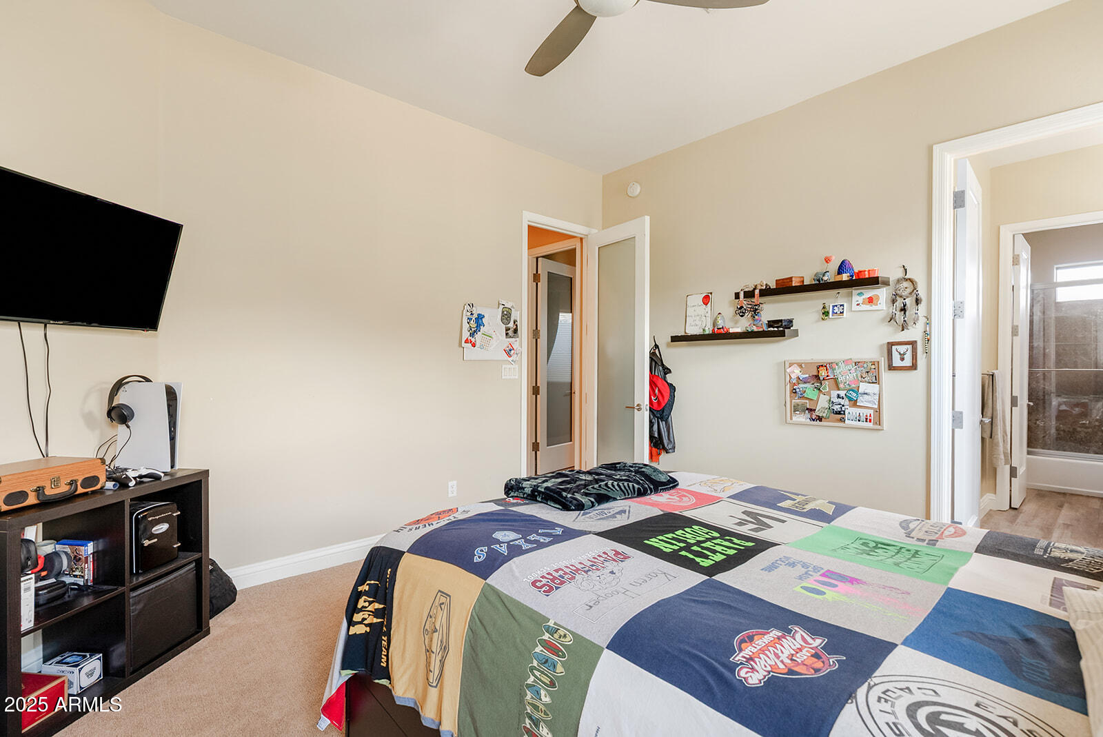 8705 South 24th Place Phoenix, AZ 85042 - Photo 23 of 43 a bedroom with a bed and a flat screen tv