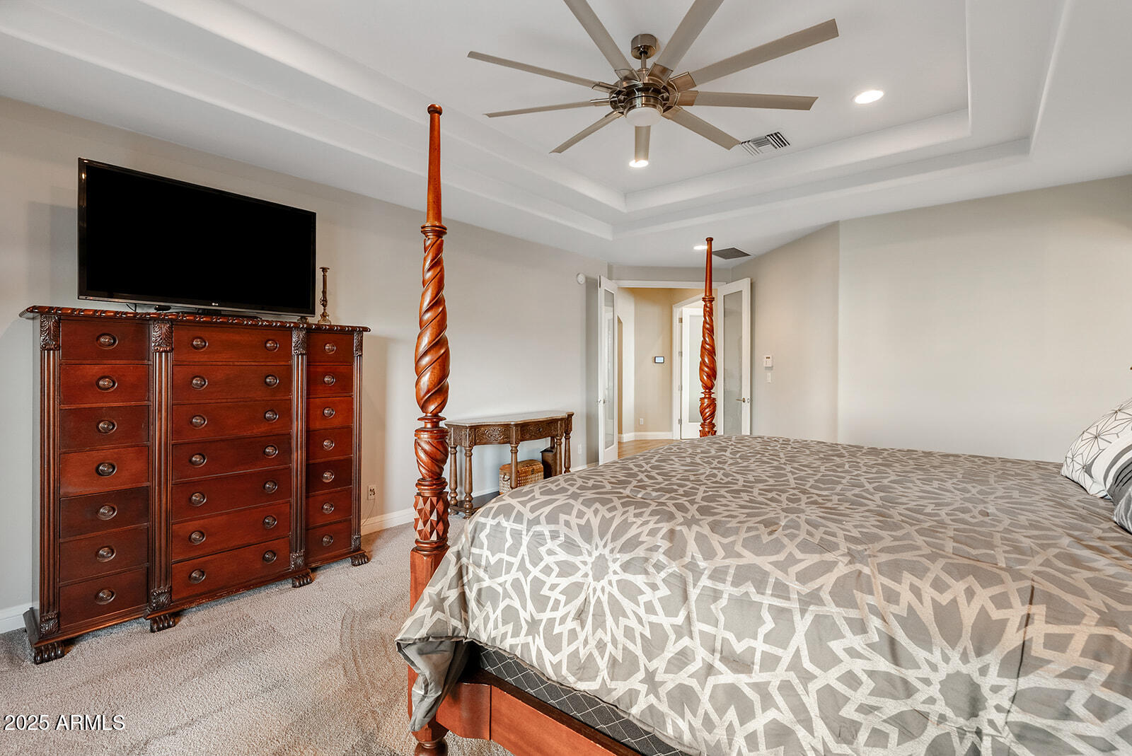 8705 South 24th Place Phoenix, AZ 85042 - Photo 29 of 43 a bedroom with a bed and a flat screen tv