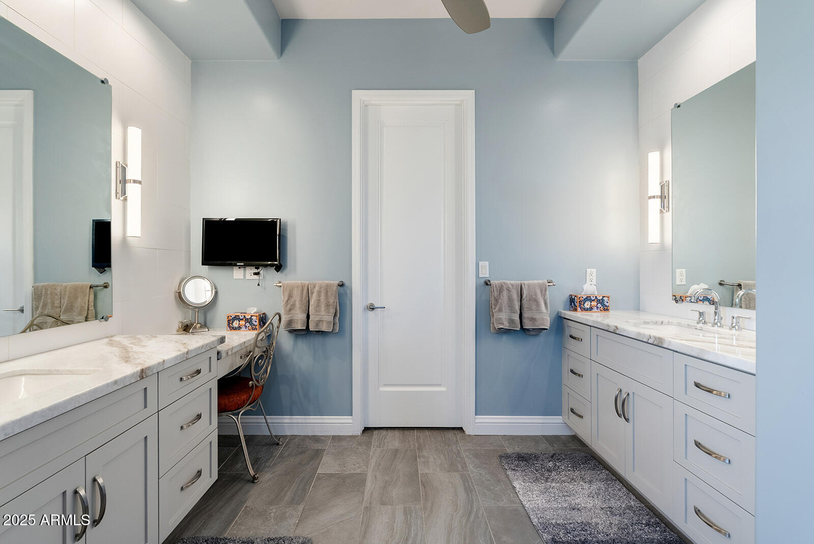 8705 South 24th Place Phoenix, AZ 85042 - Photo 31 of 43 a hall with a sink and a mirror