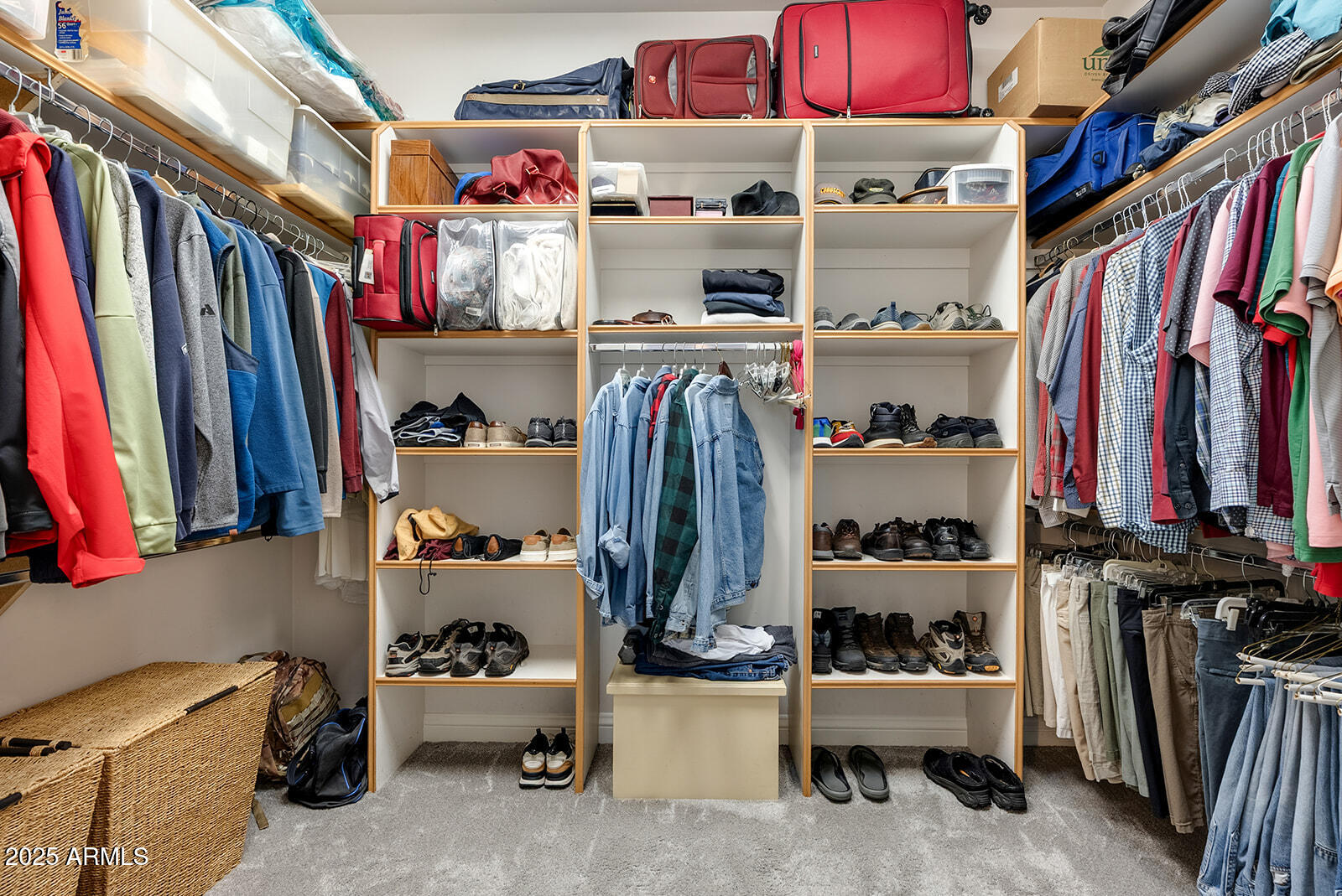 8705 South 24th Place Phoenix, AZ 85042 - Photo 33 of 43 a view of walk in closet with clothes and shoes