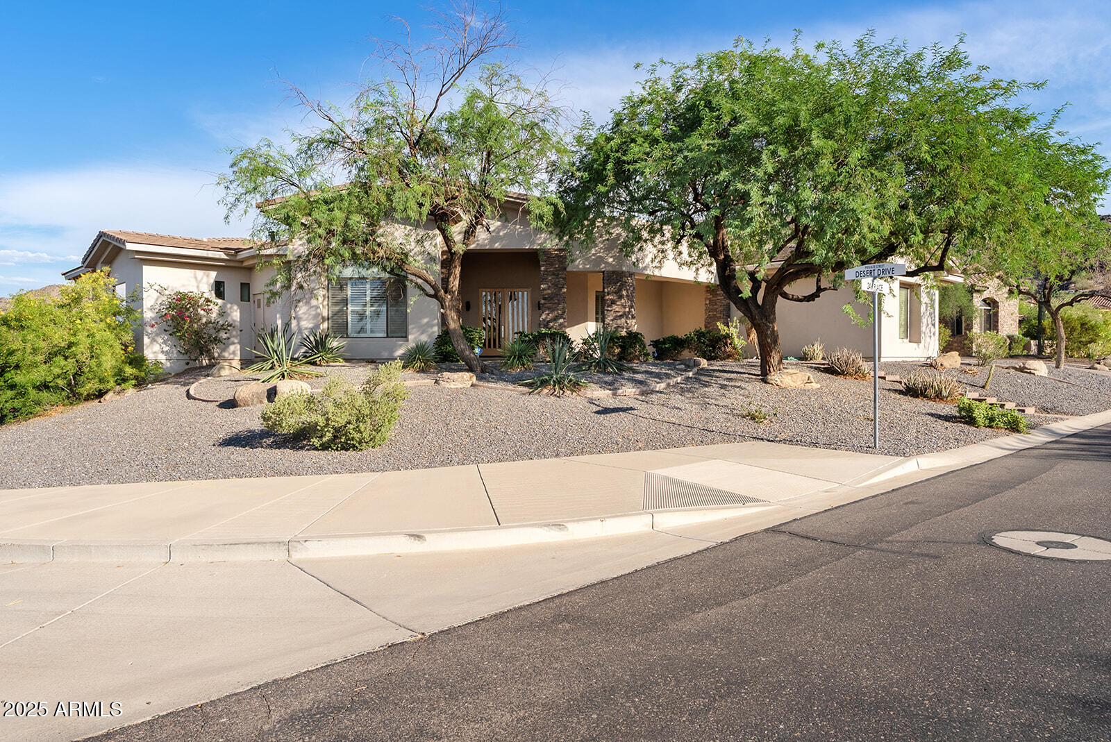 8705 South 24th Place Phoenix, AZ 85042 - Photo 5 of 43 front view of a house with a street