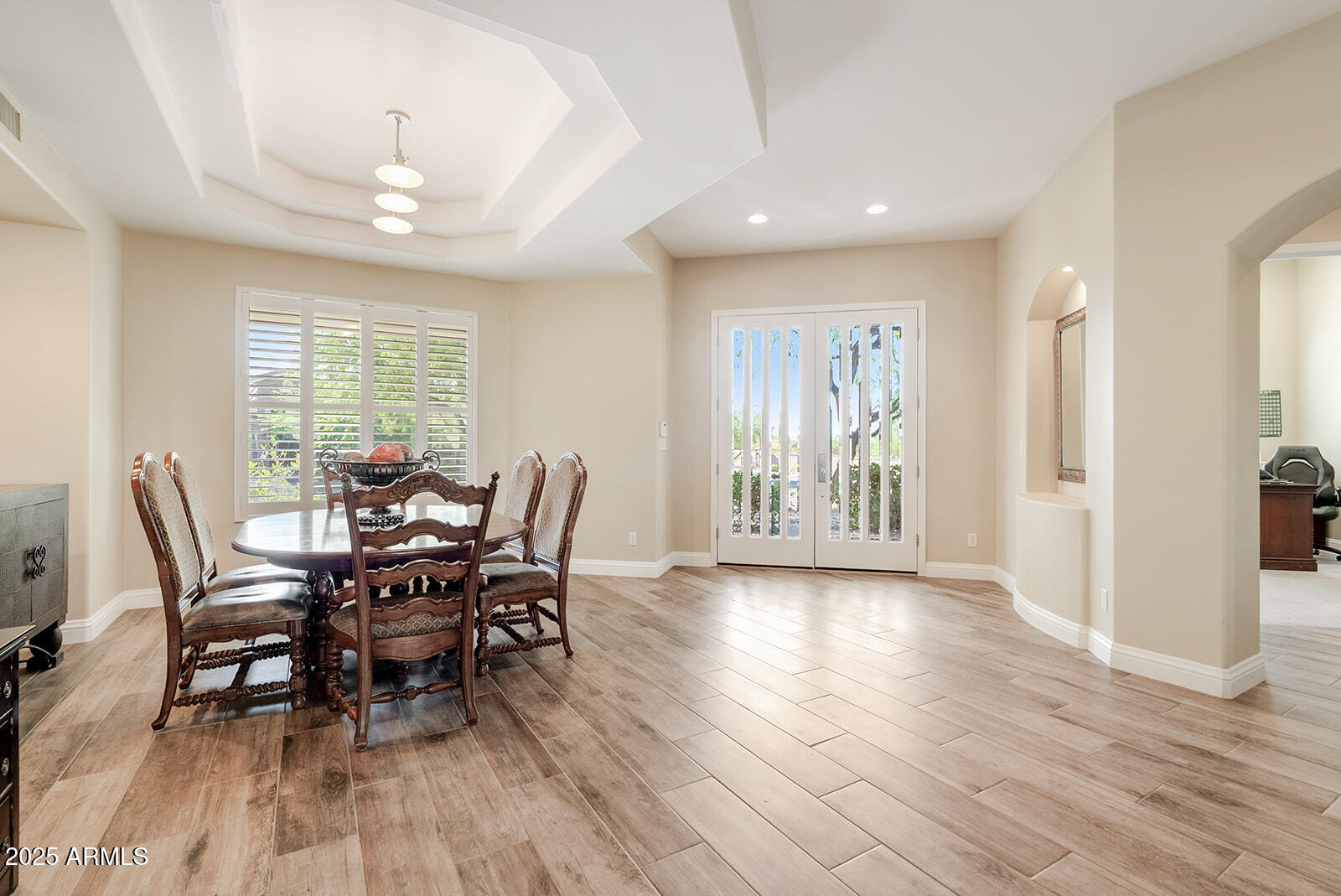 8705 South 24th Place Phoenix, AZ 85042 - Photo 7 of 43 a view of a dining room with furniture window and wooden floor