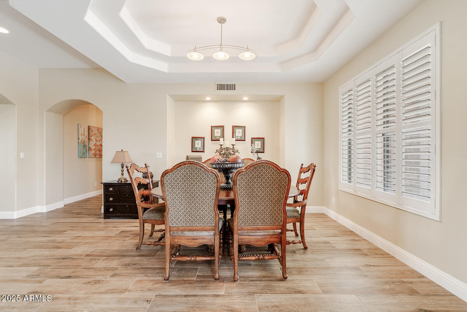8705 South 24th Place Phoenix, AZ 85042 - Photo 9 of 43 a view of a dining room with furniture window and wooden floor