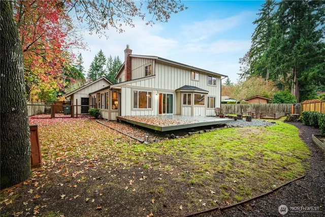 a front view of a house with a yard table and chairs