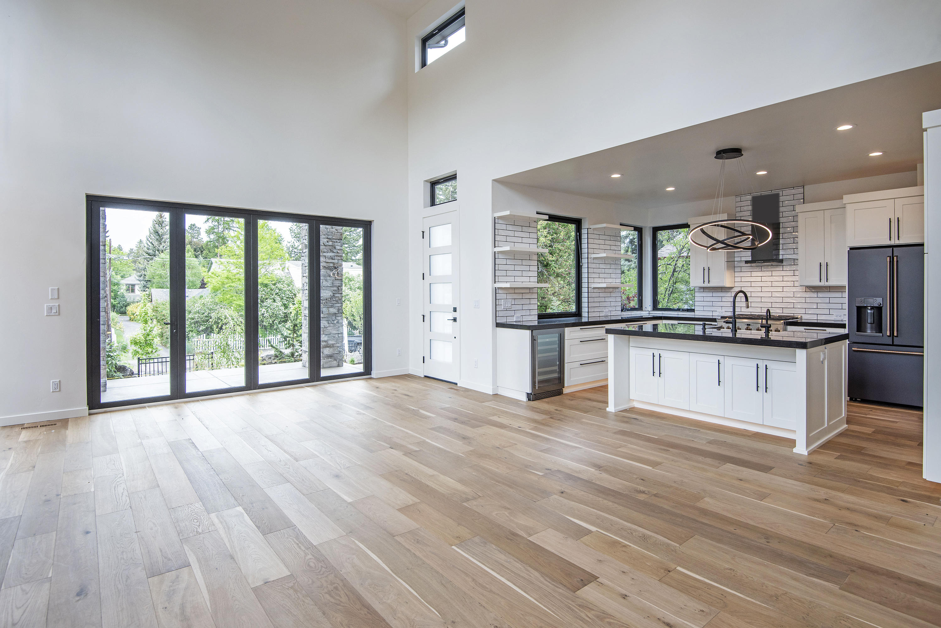 404 Northwest Riverside Boulevard Bend, OR 97703 - Photo 11 of 25 Panoramic doors allow for grand entertaining inviting the outdoors in.