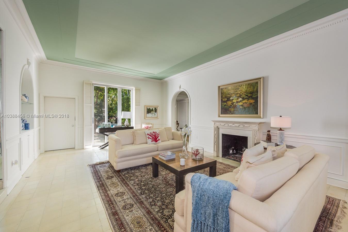 6645 Pine Tree Lane Miami Beach, FL 33141 - Photo 12 of 21 a living room with furniture and a fireplace