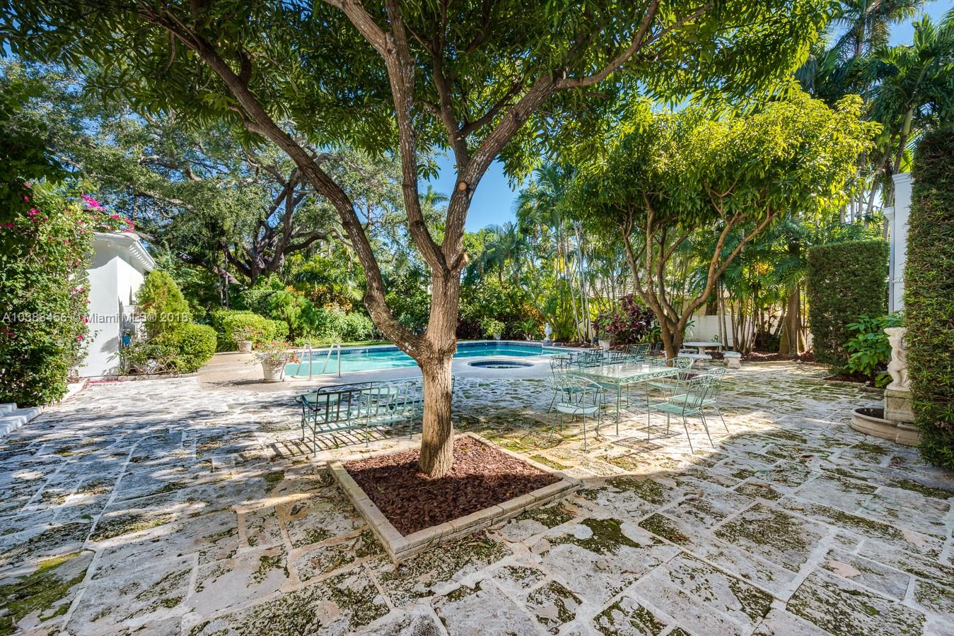 6645 Pine Tree Lane Miami Beach, FL 33141 - Photo 19 of 21 a view of a yard with plants and trees