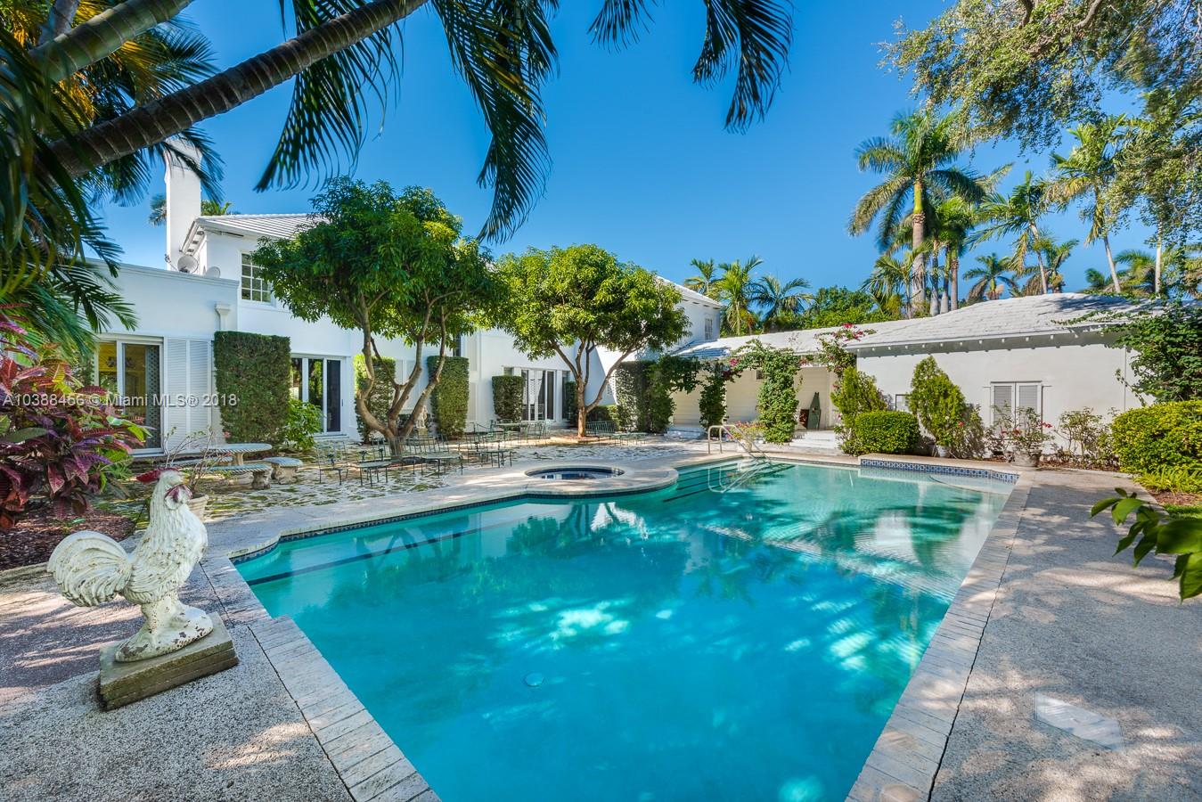 6645 Pine Tree Lane Miami Beach, FL 33141 - Photo 21 of 21 a view of a swimming pool with a patio