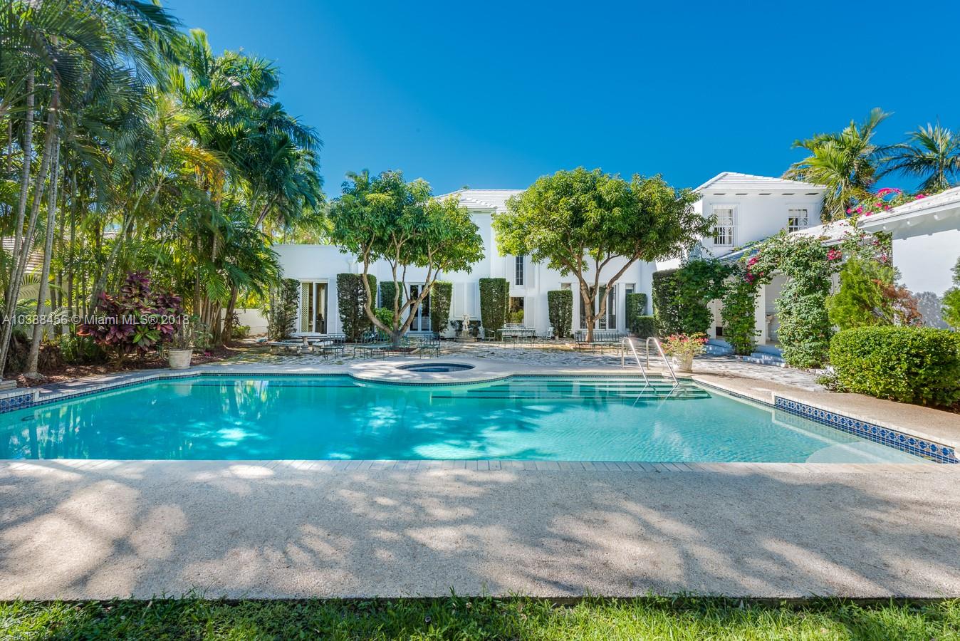 6645 Pine Tree Lane Miami Beach, FL 33141 - Photo 6 of 21 a front view of a house with a yard