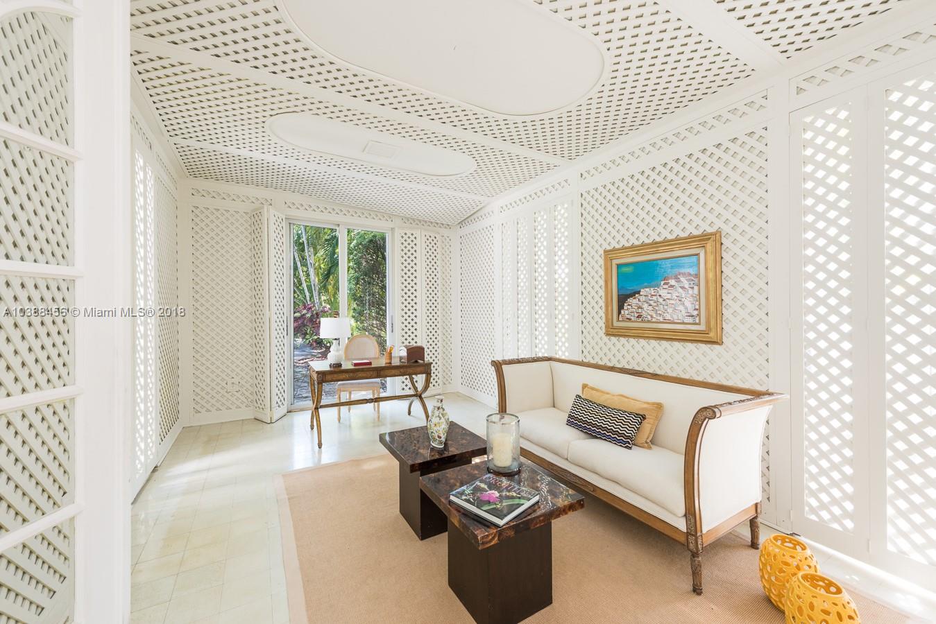 6645 Pine Tree Lane Miami Beach, FL 33141 - Photo 7 of 21 a living room with furniture and a window