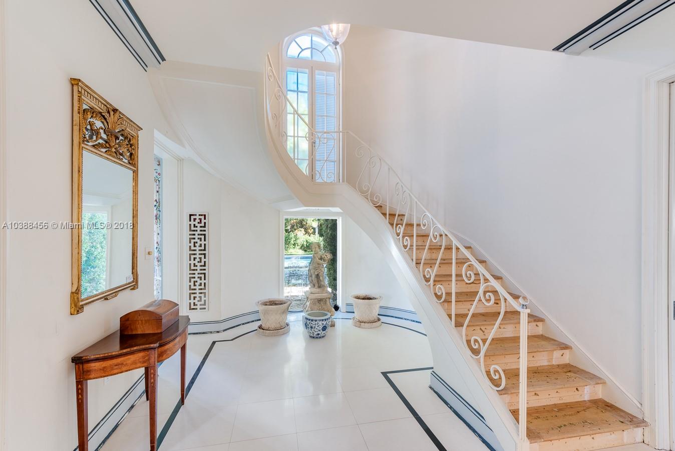 6645 Pine Tree Lane Miami Beach, FL 33141 - Photo 10 of 21 a view of a livingroom with furniture and staircase