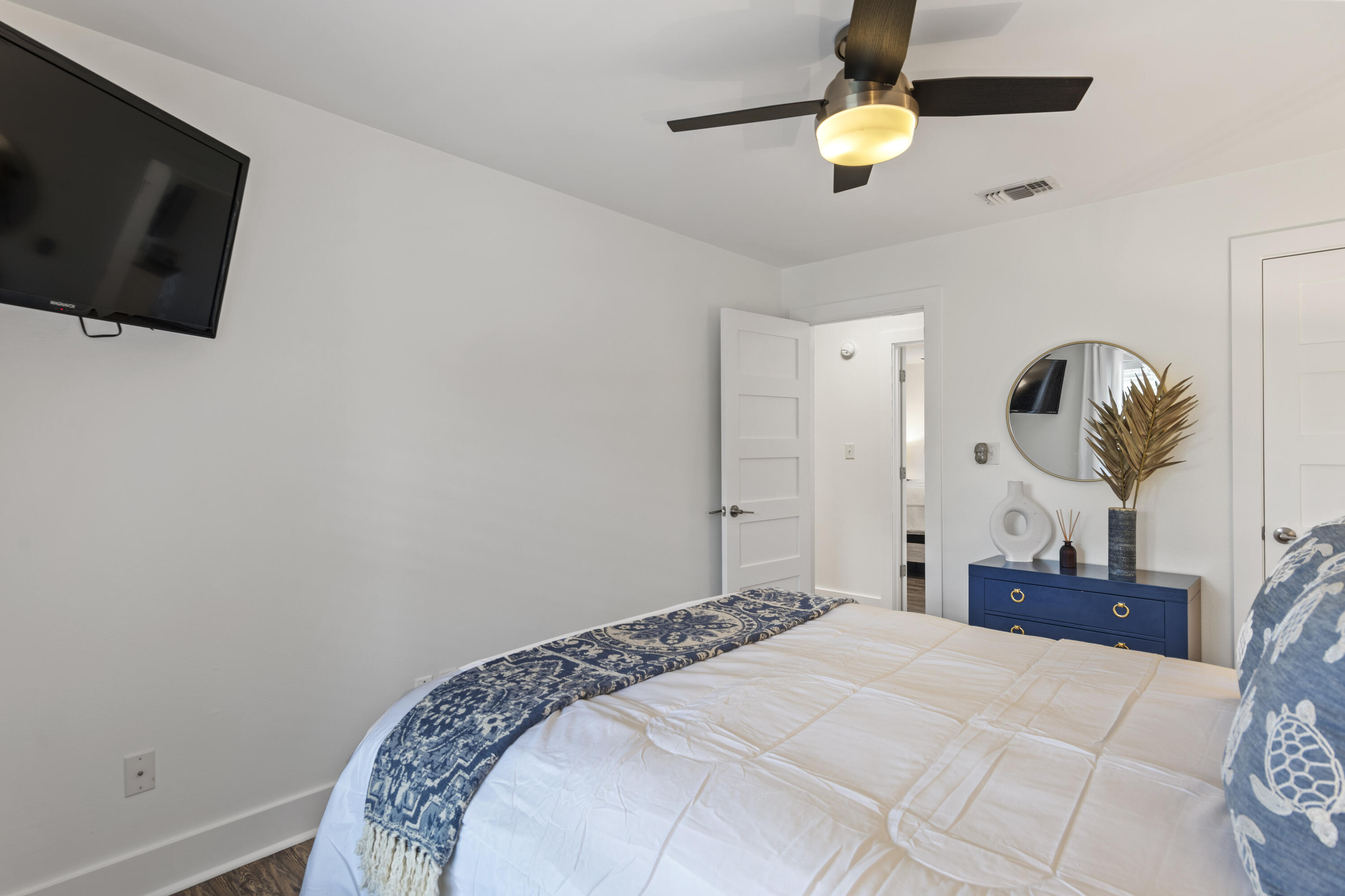 3799 East County Highway 30A, Unit F13 Santa Rosa Beach, FL 32459 - Photo 19 of 30 a bedroom with a bed and a chandelier