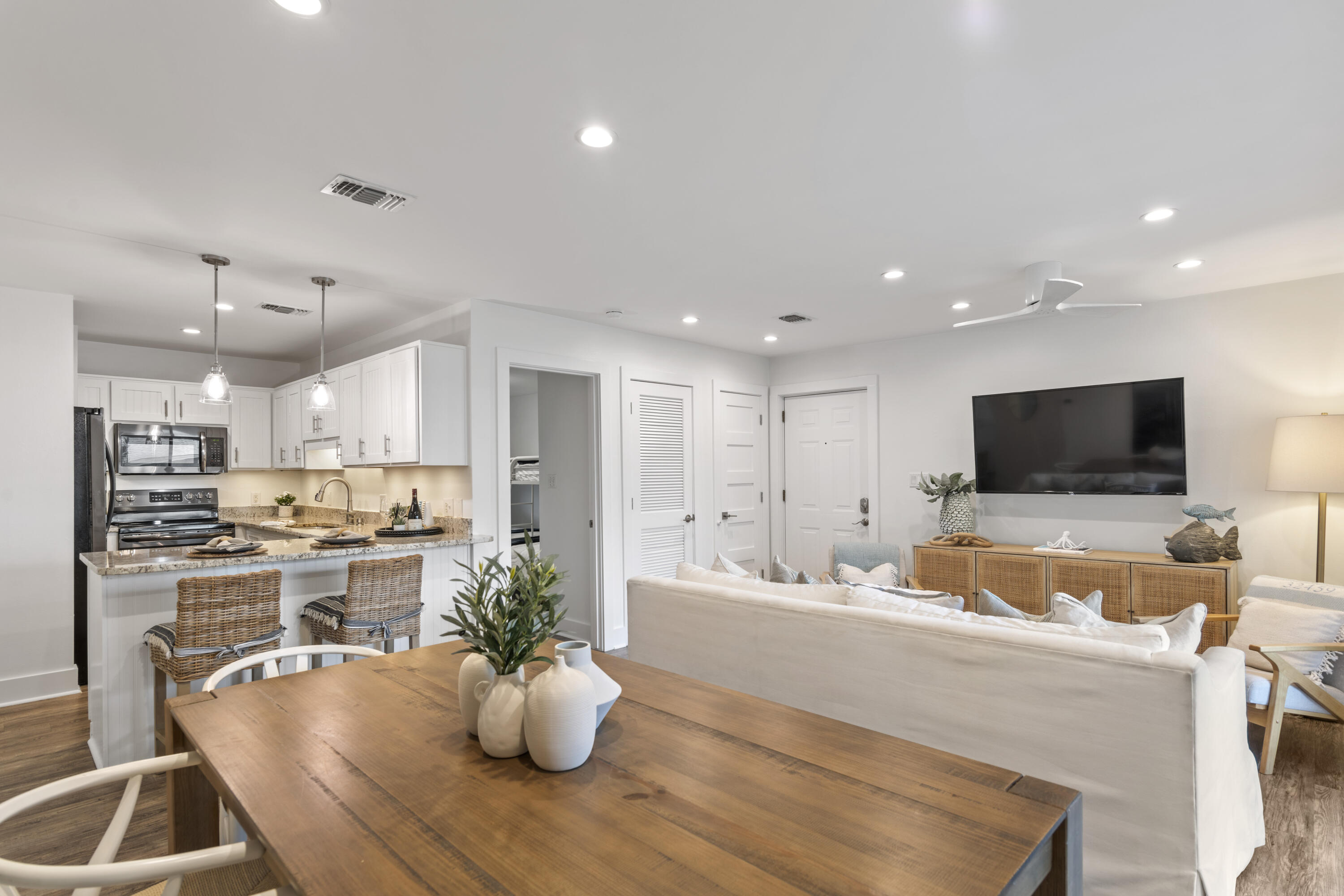 3799 East County Highway 30A, Unit F13 Santa Rosa Beach, FL 32459 - Photo 6 of 30 a large kitchen with a table and chairs