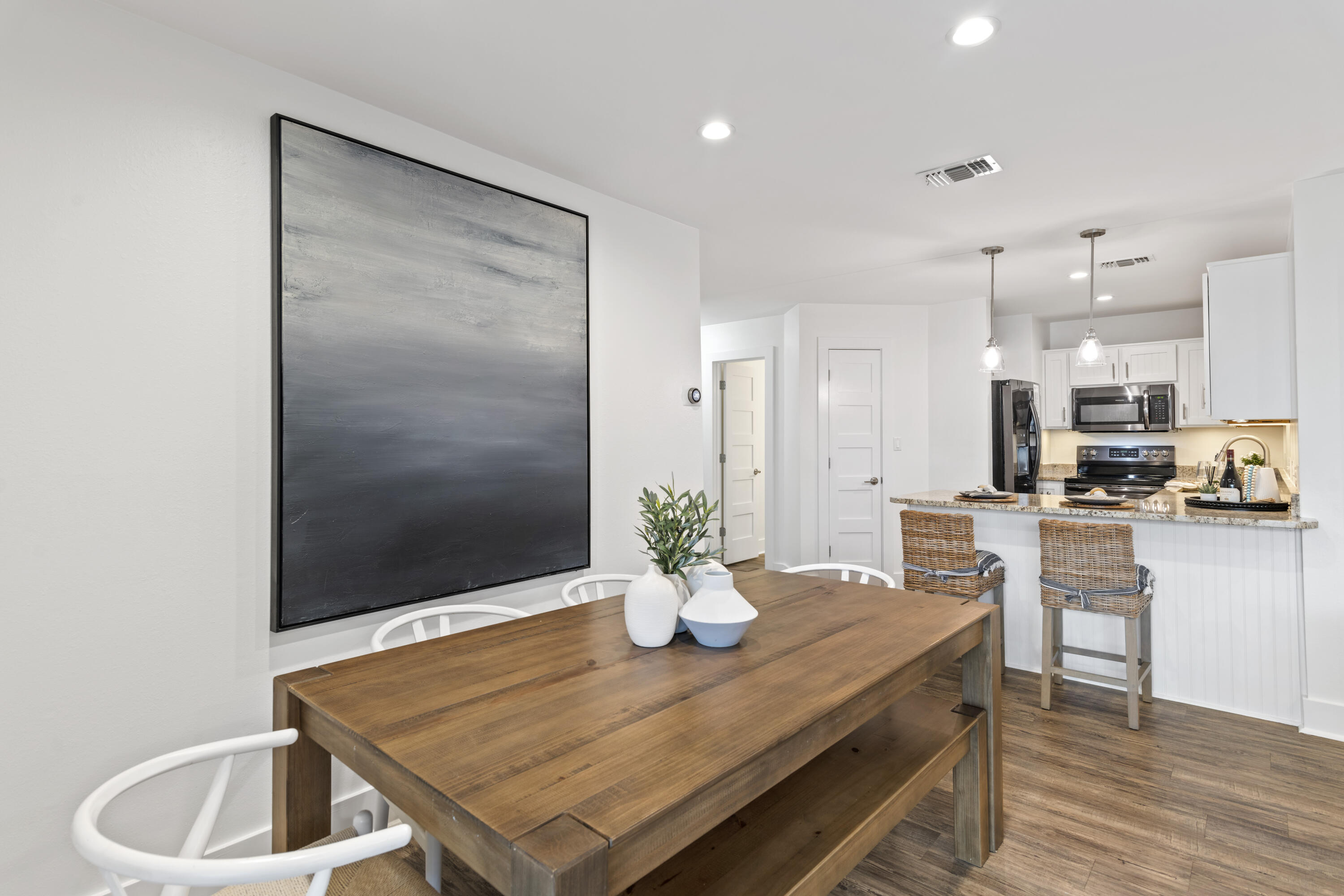 3799 East County Highway 30A, Unit F13 Santa Rosa Beach, FL 32459 - Photo 7 of 30 a kitchen with a table and chairs in it
