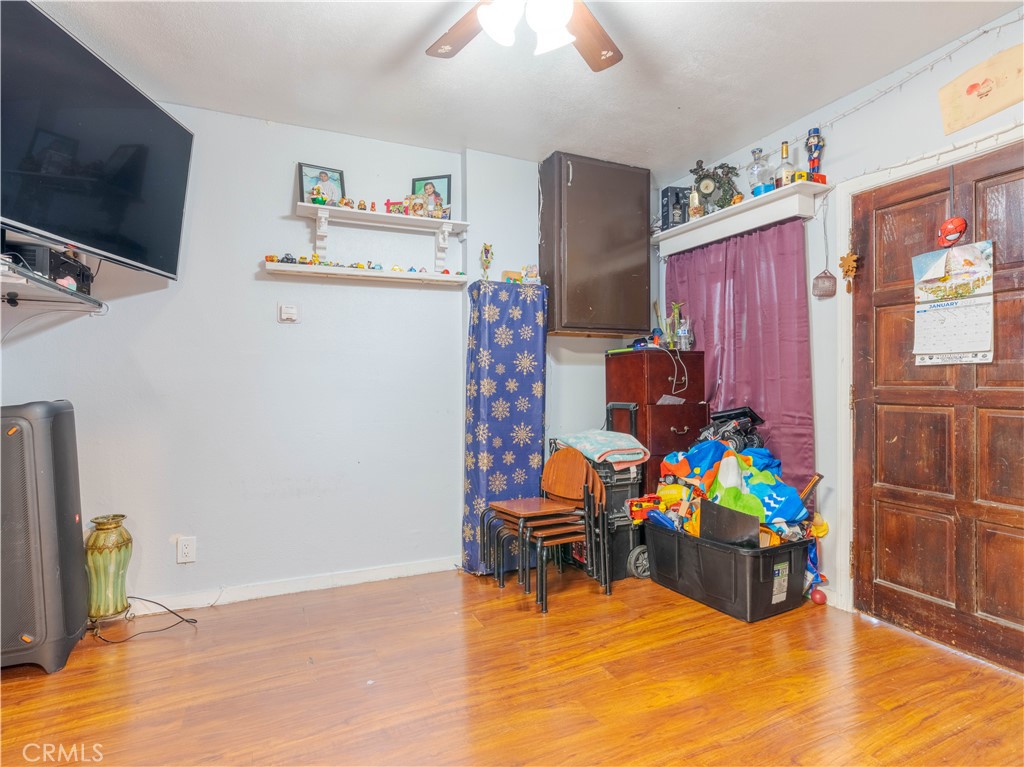 1211 Hoffman Avenue Long Beach, CA 90813 - Photo 12 of 33 a living room filled with furniture and a flat screen tv