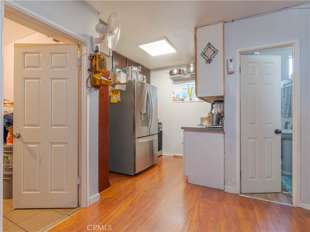 1211 Hoffman Avenue Long Beach, CA 90813 - Photo 13 of 33 a view of a refrigerator and wooden floor