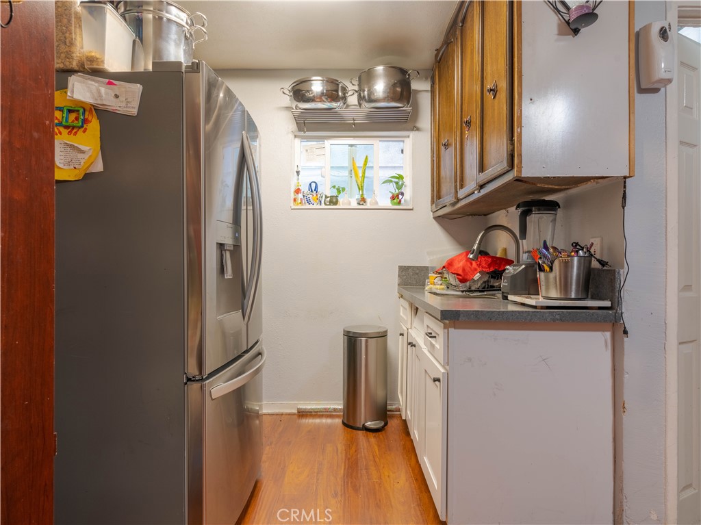 1211 Hoffman Avenue Long Beach, CA 90813 - Photo 14 of 33 a kitchen with stainless steel appliances granite countertop a refrigerator and a stove