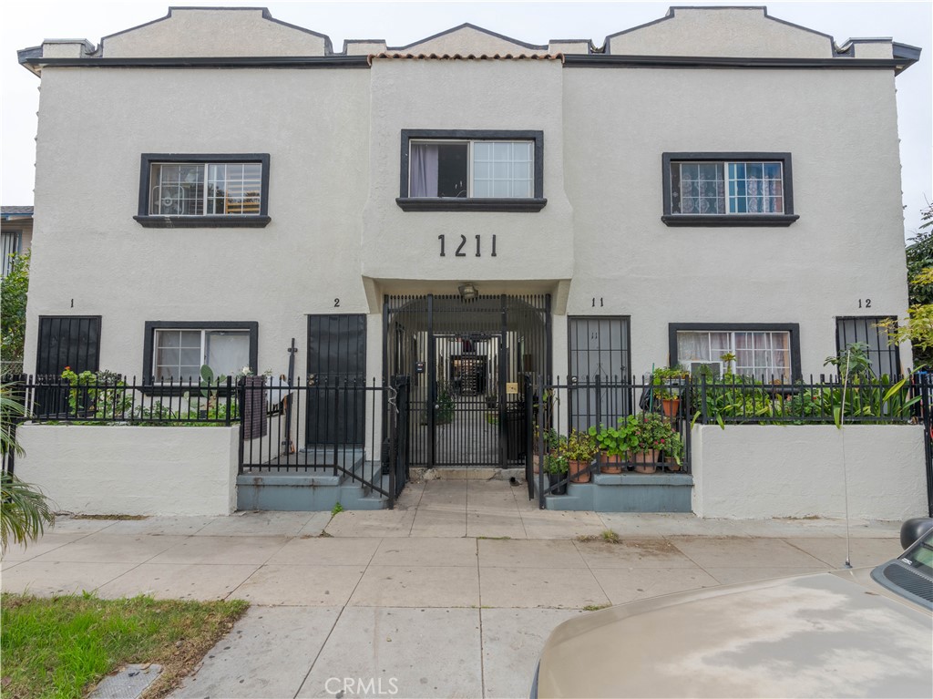1211 Hoffman Avenue Long Beach, CA 90813 - Photo 2 of 33 front view of a brick house with potted plants