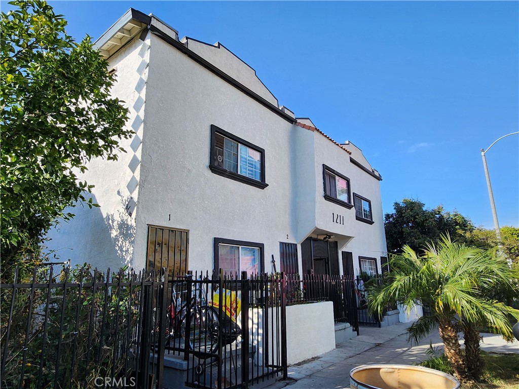 1211 Hoffman Avenue Long Beach, CA 90813 - Photo 4 of 33 a front view of a house with balcony