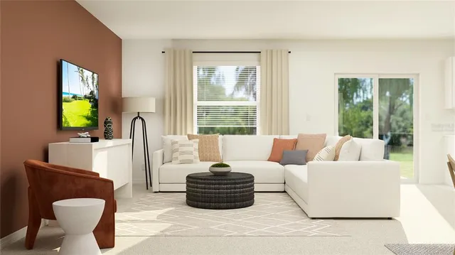 a living room with furniture a flat screen tv and a large window