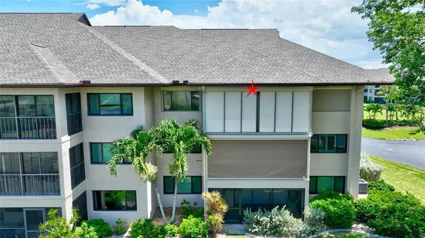 front view of house with potted plants