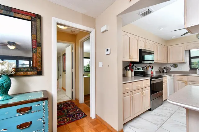 a kitchen with cabinets and appliances