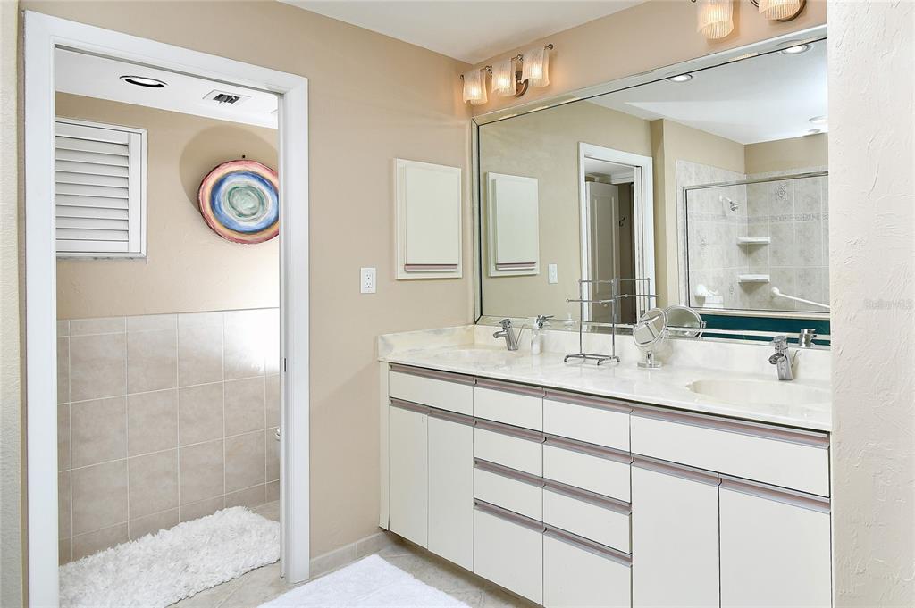 2 Pirates Lane, Unit 21C Punta Gorda, FL 33955 - Photo 21 of 36 a bathroom with a sink and a mirror