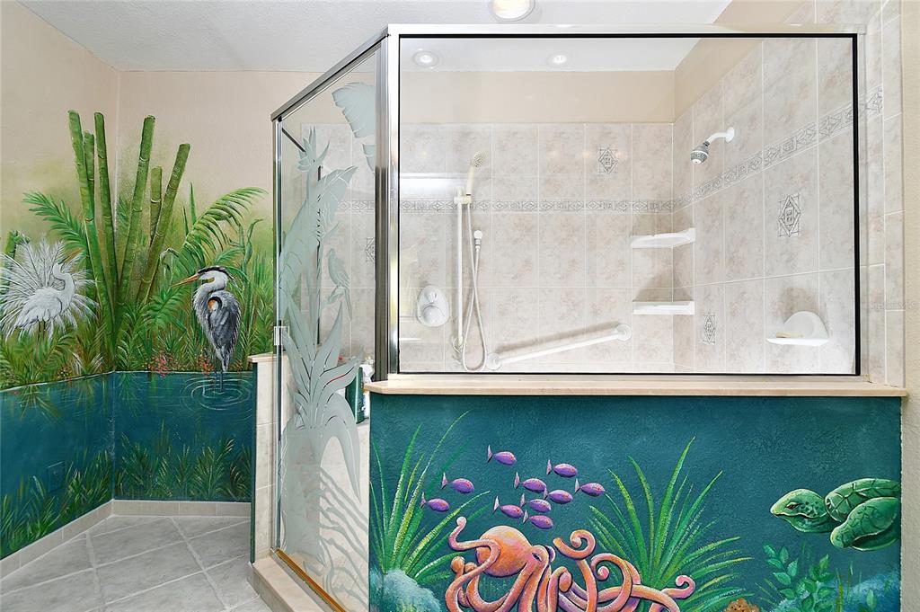 2 Pirates Lane, Unit 21C Punta Gorda, FL 33955 - Photo 22 of 36 a bathroom with a sink a mirror and a shower