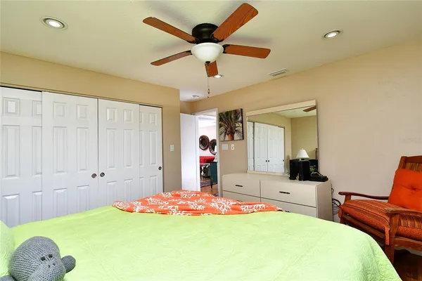 a bed room with a bed and a chandelier