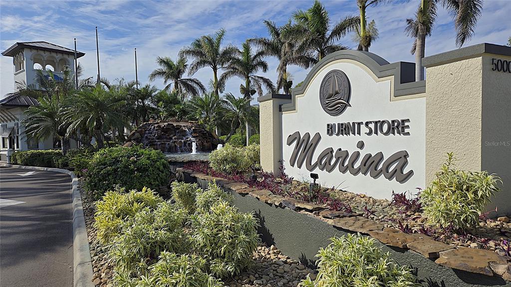 2 Pirates Lane, Unit 21C Punta Gorda, FL 33955 - Photo 28 of 36 a sign that is on a wall next to a road