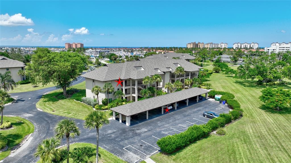 2 Pirates Lane, Unit 21C Punta Gorda, FL 33955 - Photo 33 of 36 an aerial view of a house with a yard and lake view