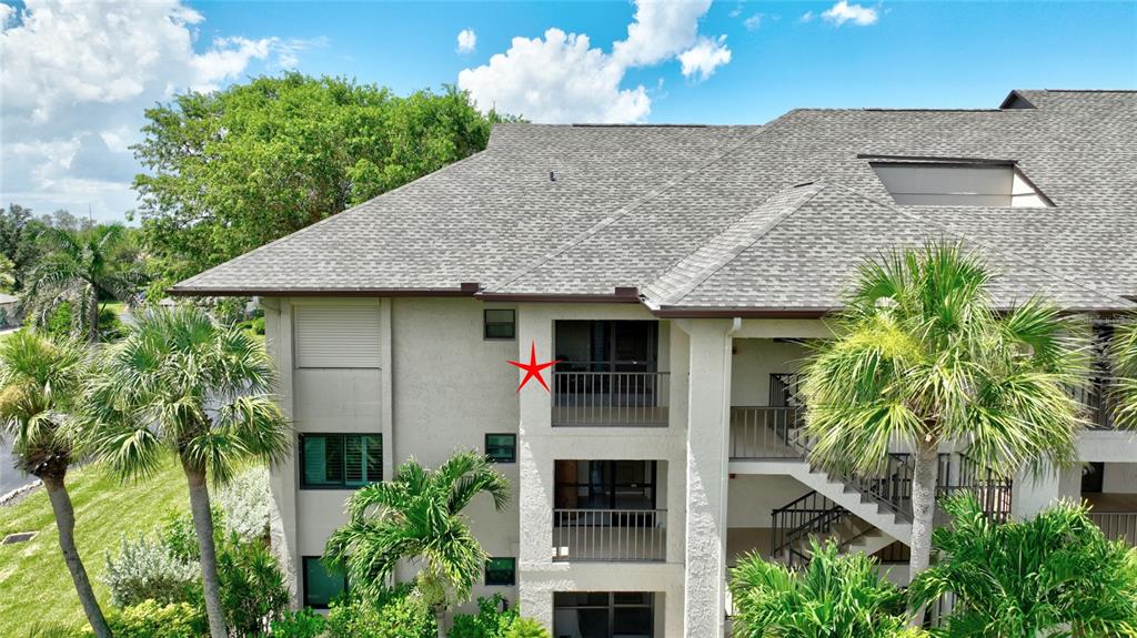 2 Pirates Lane, Unit 21C Punta Gorda, FL 33955 - Photo 35 of 36 a front view of a house with plants