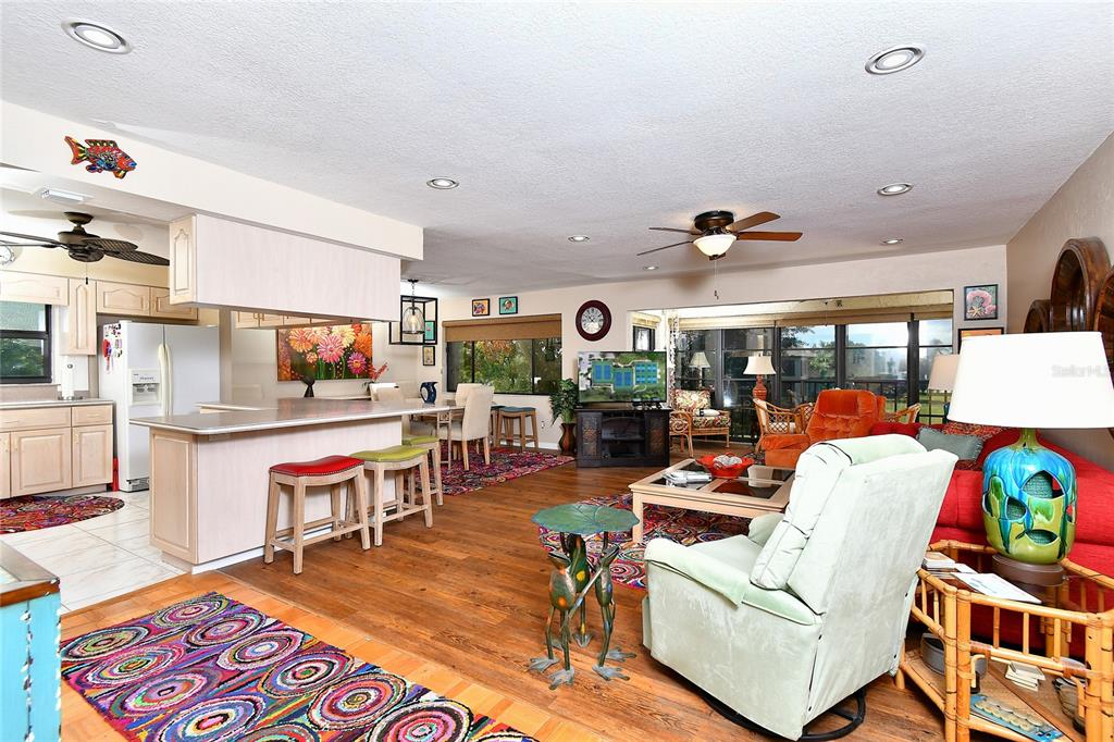 2 Pirates Lane, Unit 21C Punta Gorda, FL 33955 - Photo 5 of 36 a living room with lots of furniture and a flat screen tv