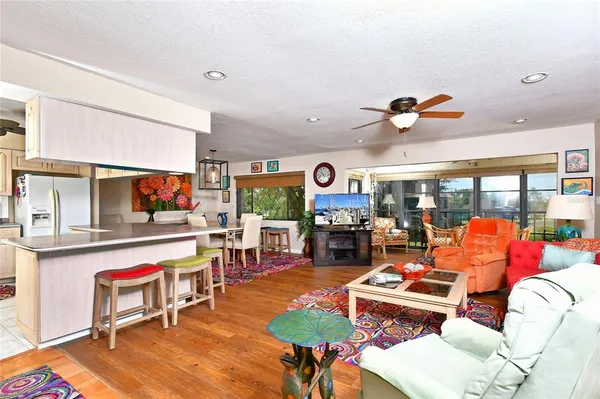 a living room with furniture a rug and a fireplace