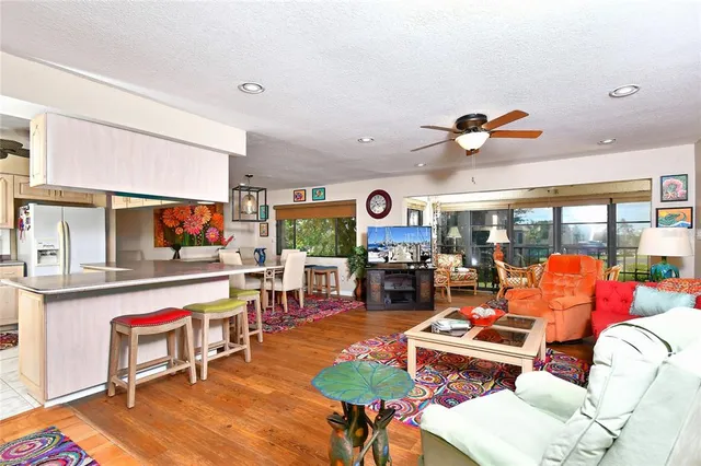 a living room with furniture a rug and a fireplace