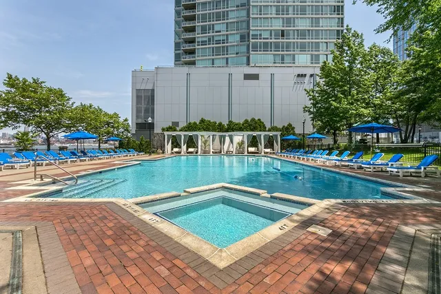 a view of swimming pool with outdoor seating and yard