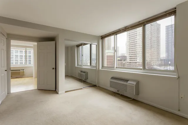 a view of an empty room with a window