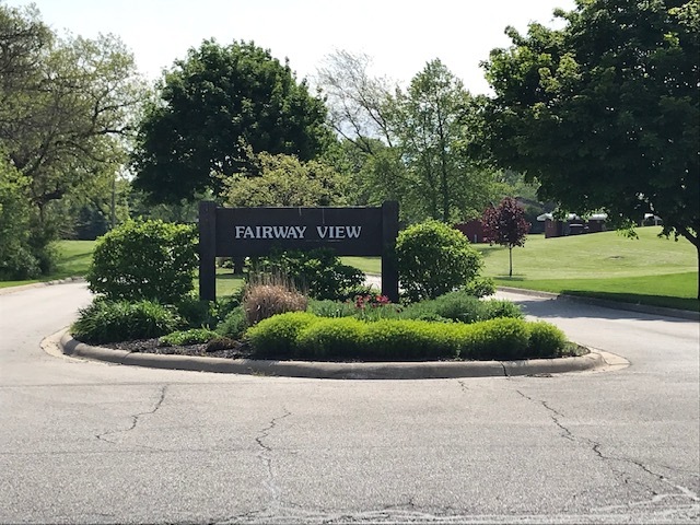 a sign on the side of the road