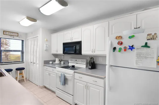 a kitchen with a sink and a stove top oven