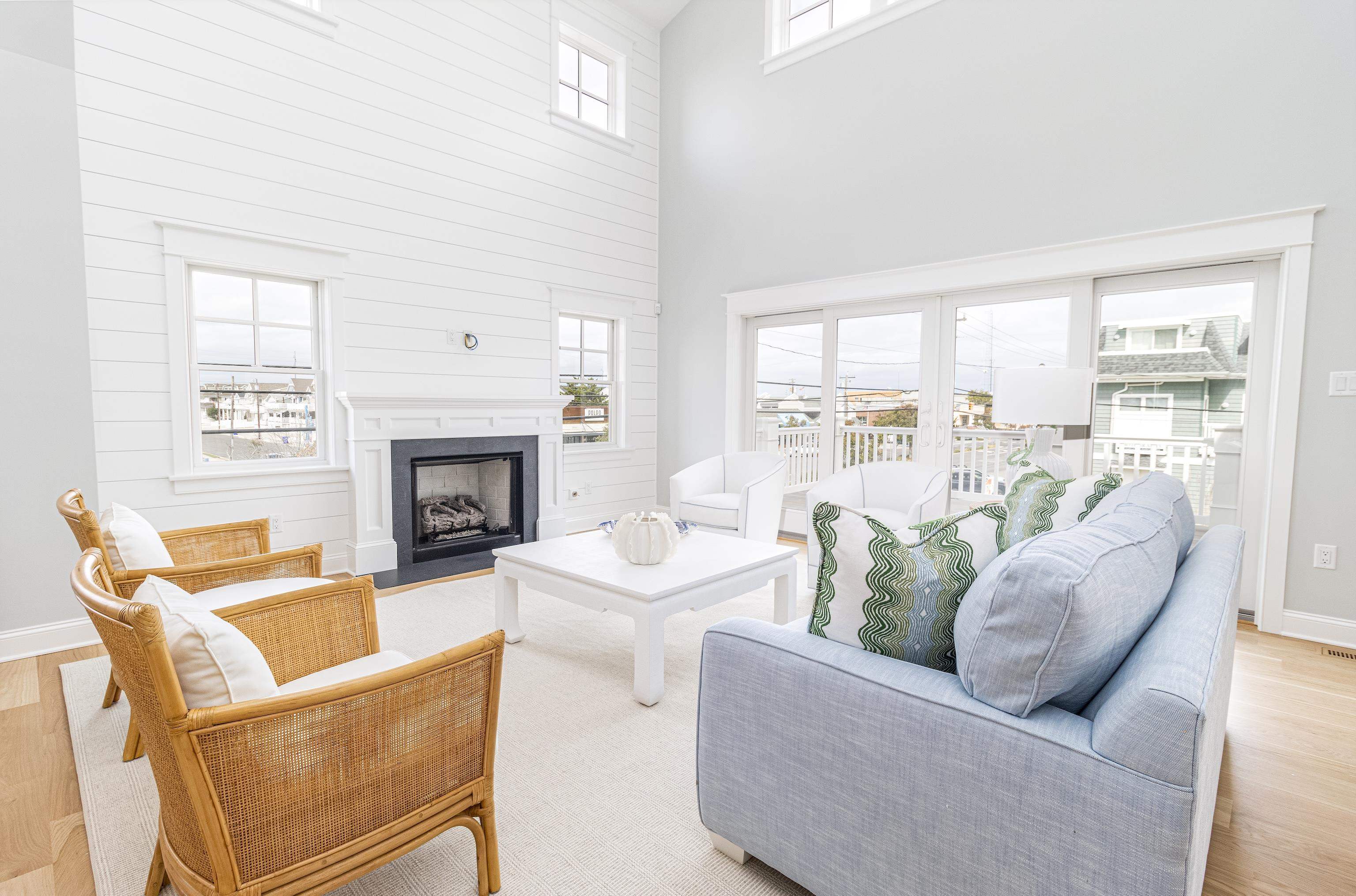 188 33rd Avalon, NJ 08202 - Photo 15 of 36 a living room with furniture a fireplace and a large window