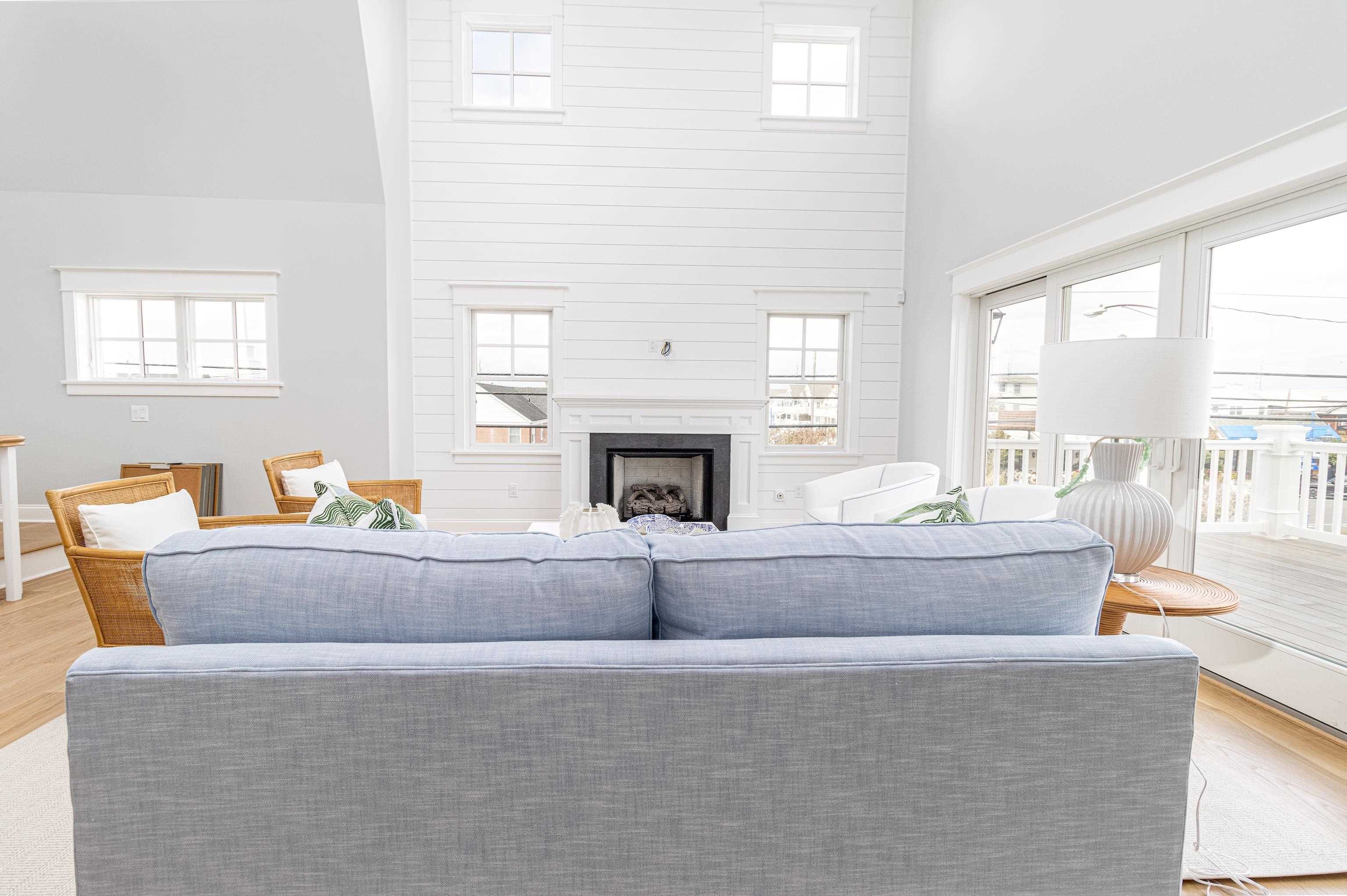 188 33rd Avalon, NJ 08202 - Photo 16 of 36 a living room with furniture a fireplace and a large window