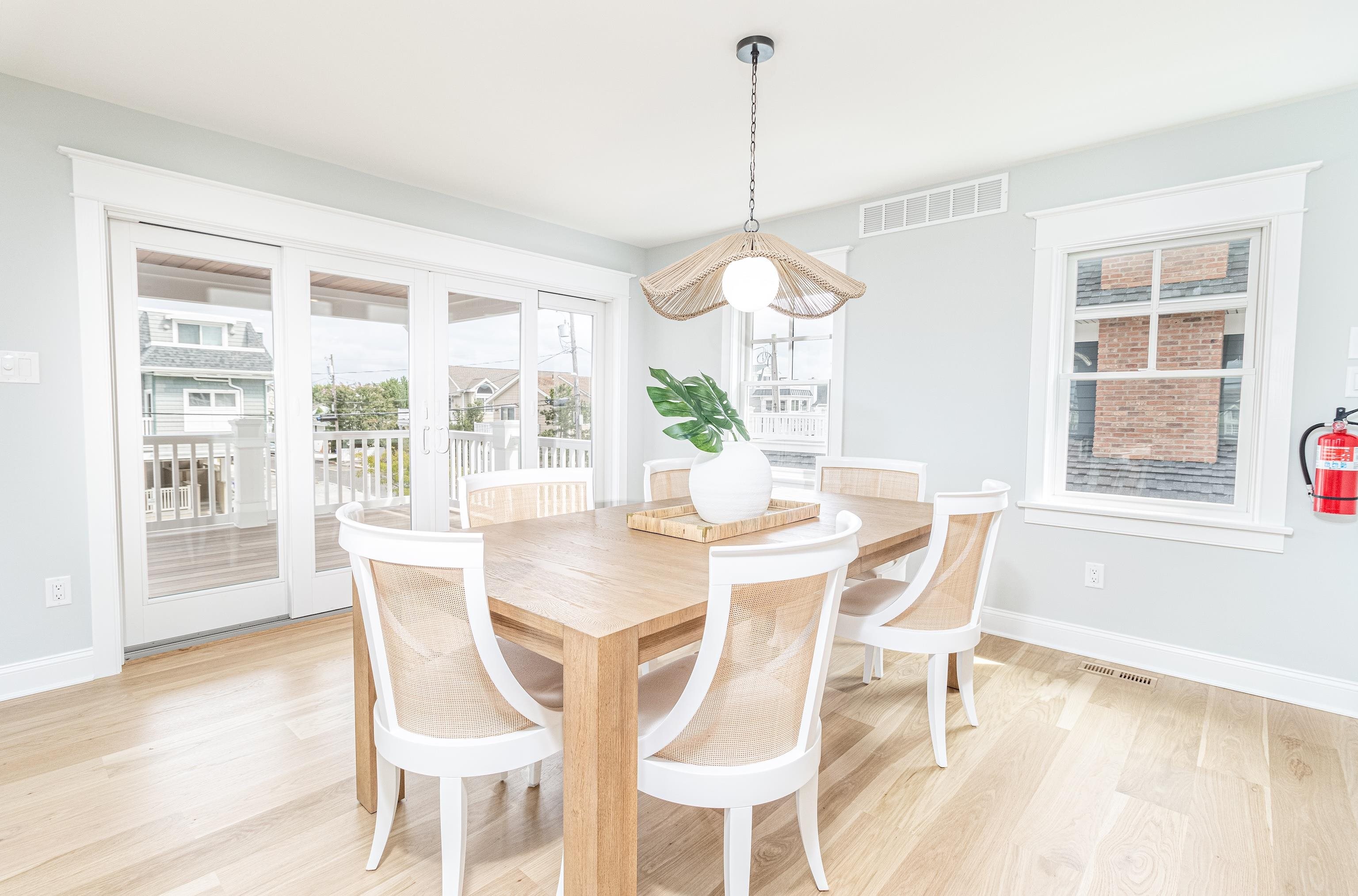 188 33rd Avalon, NJ 08202 - Photo 21 of 36 a view of a dining room with furniture wooden floor and a chandelier