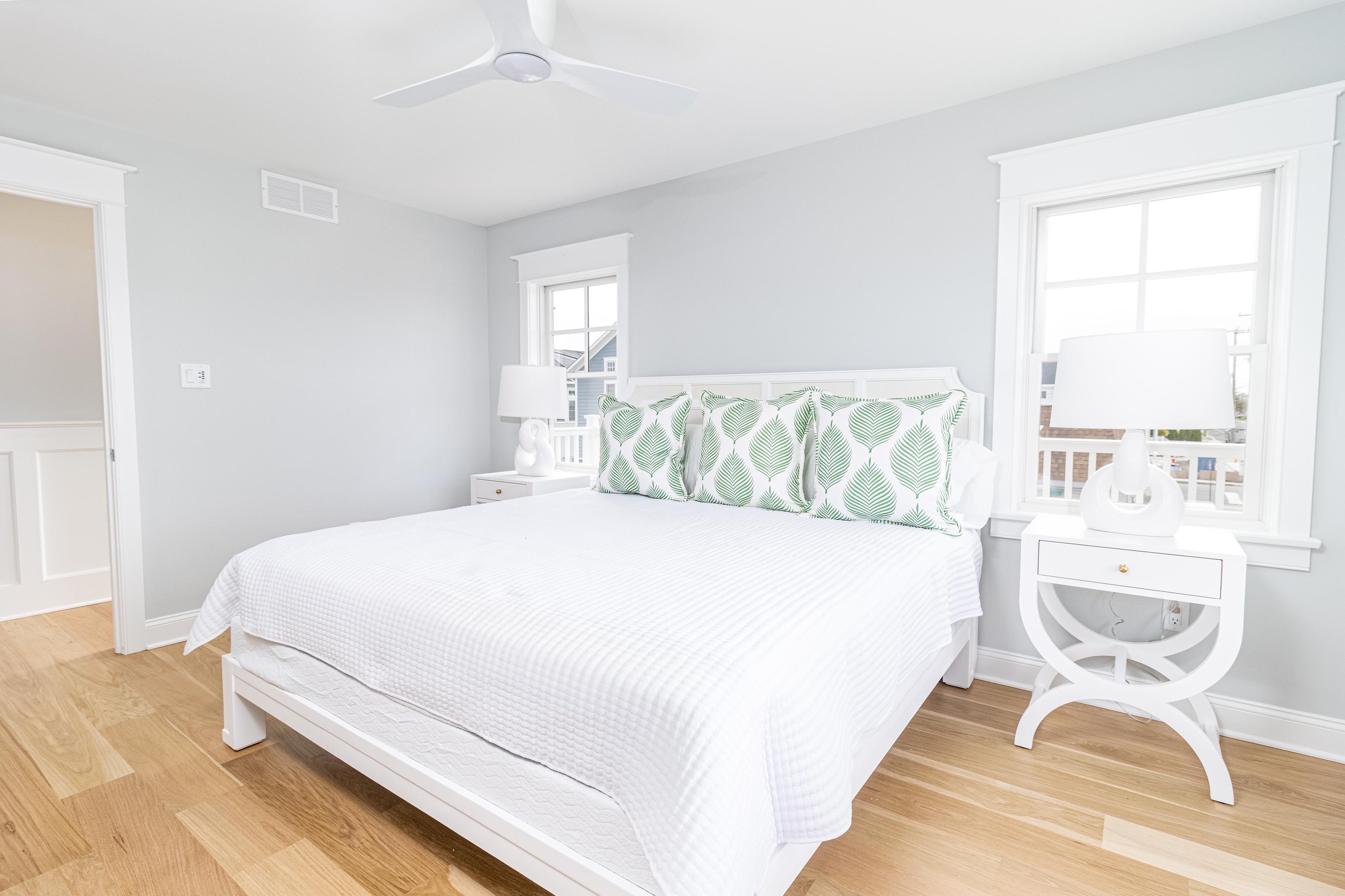 188 33rd Avalon, NJ 08202 - Photo 24 of 36 a large white bed sitting in a bedroom next to a window