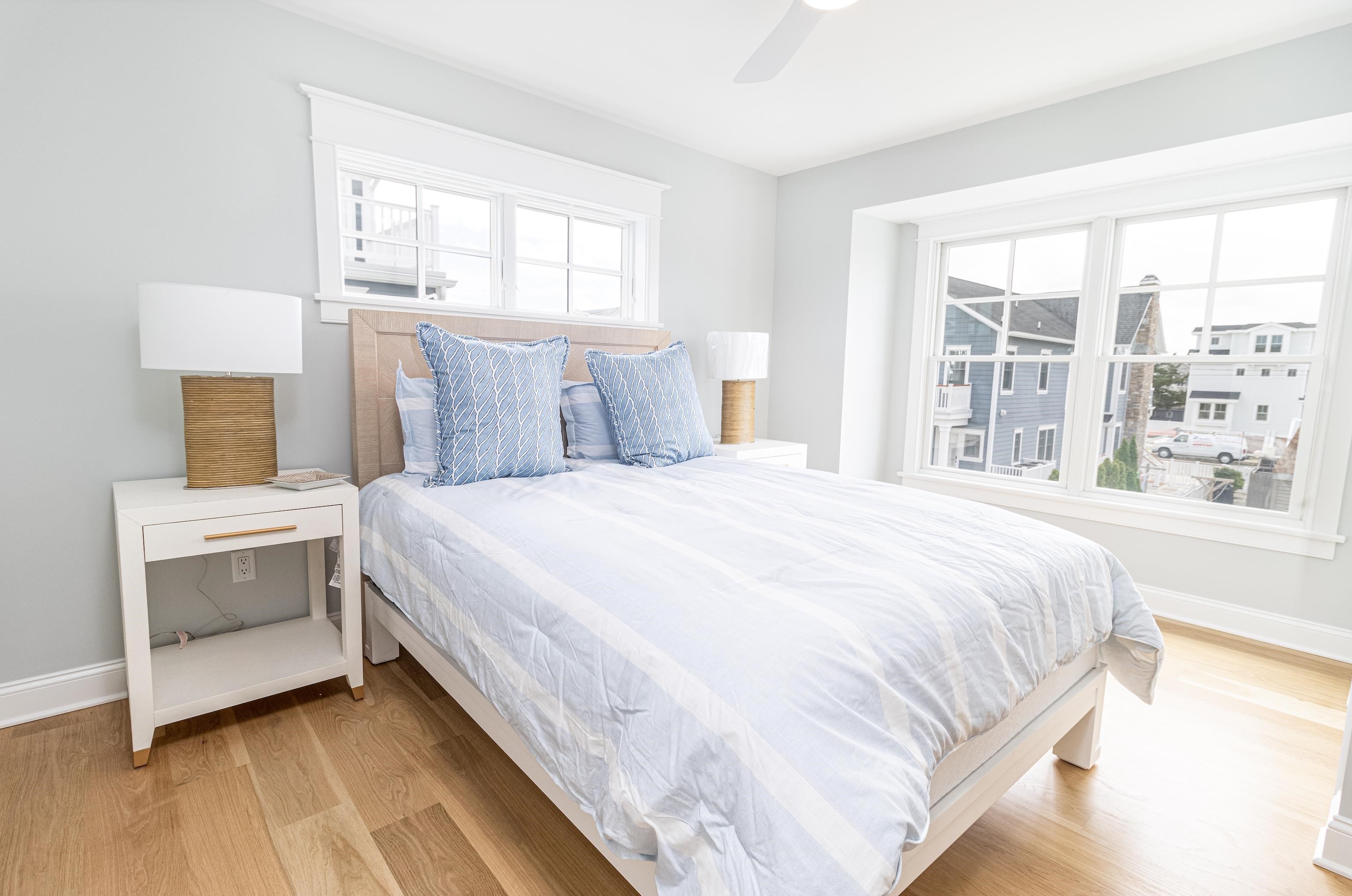 188 33rd Avalon, NJ 08202 - Photo 26 of 36 a bedroom with a large bed and a large window