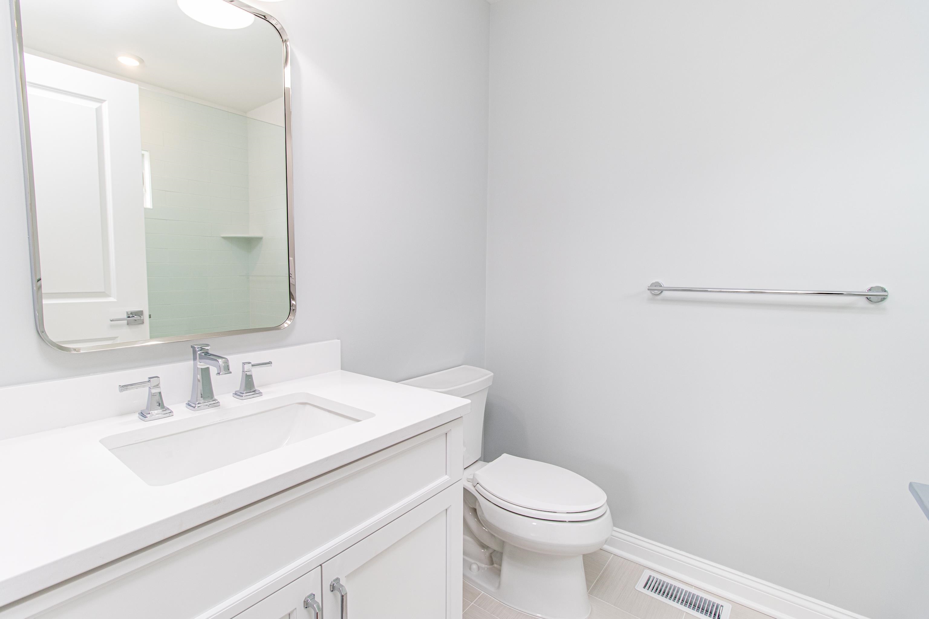 188 33rd Avalon, NJ 08202 - Photo 27 of 36 a bathroom with a sink a toilet and mirror